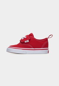 Baskets basses Vans rouges avec semelle blanche, coutures blanches, lacets blancs et un onglet au talon.