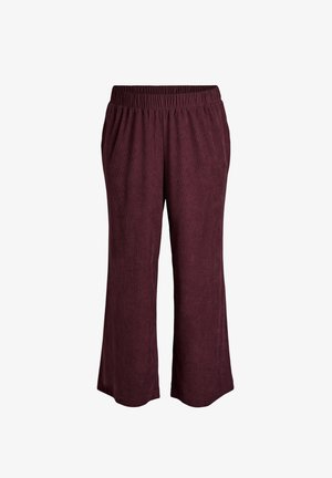 Burgundiškos plačios kelnės su elastinga juosta, minkšta tekstūra, dvi šoninės kišenės ir laisvas siluetas.