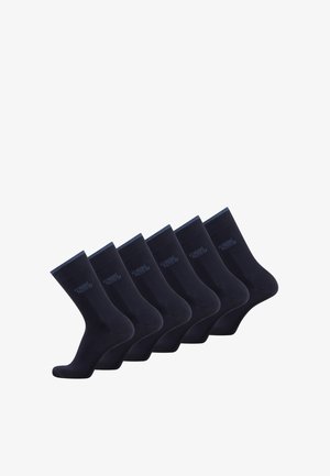 Chaussettes bleu foncé dans un paquet de six, avec une texture lisse et un poignet côtelé. Chaque chaussette est unie, sans motifs ni dessins.