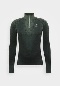 Zielona sportowa bluzka z długim rękawem, z kołnierzem na pół-zamek, charakteryzująca się teksturowanym wzorem i dopasowanym krojem, wykonana z elastycznego, oddychającego materiału.
