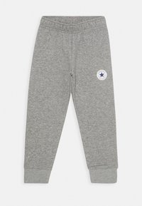 Grå bomulds sweatsbukser med ribbede manchetter, elastisk talje og et rund logo patch med en blå stjerne på venstre lår.