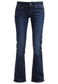 Jean bleu foncé en denim, avec un design à jambes évasées, style cinq poches, et des accessoires métalliques à la ceinture et aux poches.