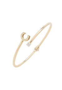 Gold-tone bracelet featuring a curved design with a crystal-embellished accent and a smooth surface. Includes a small gemstone detail.