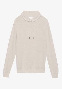 Pull beige en tricot avec un col roulé, accents à cordon, manches longues et poignets et ourlet côtelés, doté d'un tissu texturé.