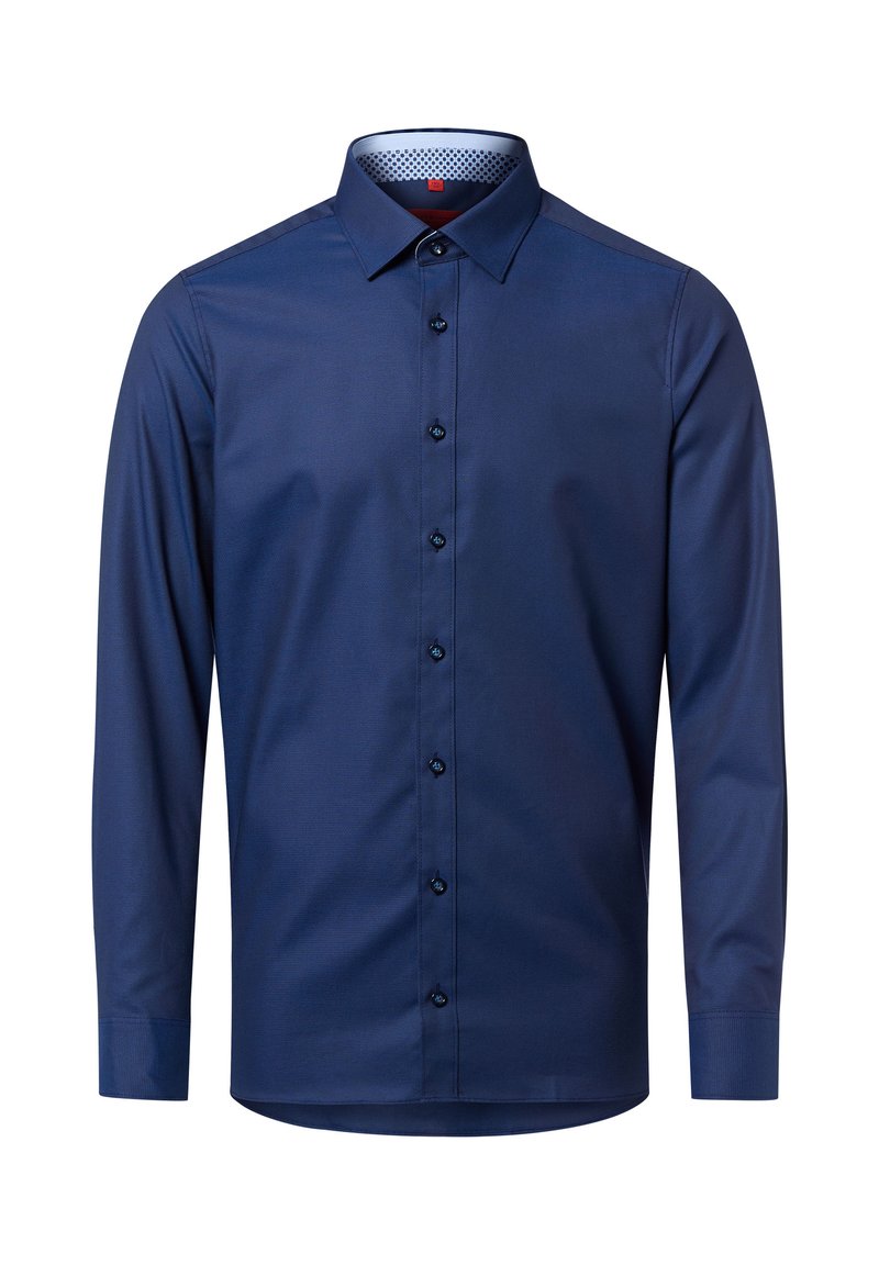 Marineblaue, langärmlige Hemdjacke aus glattem Stoff mit einem strukturierten Kragen und einem dezenten, gemusterten Innenfutter. Knopfdetails in Dunkelblau.