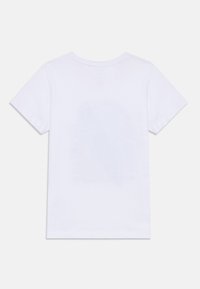 T-shirt en coton blanc avec un col ras du cou, des manches courtes et une texture lisse. Le dos ne présente aucun graphique ni motif.