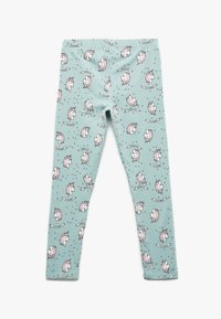 Leggings de color azul claro con un patrón de unicornios, que presentan acentos en rosa, estrellas y pancartas decorativas. Material suave y elástico, diseño ajustado.