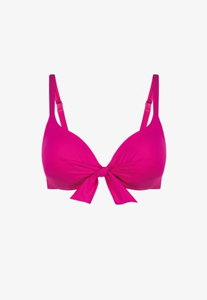 Jasnoróżowy wyściełany biustonosz z regulowanymi ramiączkami i kokardką zawiązaną z przodu na środku.