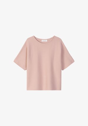 Short-sleeve top in light pink, made from textured fabric. Features a round neckline and an oversized fit. Tag visible at the neckline.