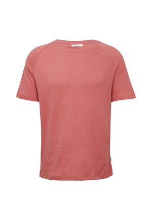 T-shirt à manches courtes dans une douce couleur corail pâle avec une finition texturée et un col rond. Présente des manches raglan et une petite étiquette de logo.