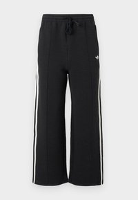 Μαύροι φαρδιά αθλητικοί παντελόνες με λευκές πλαϊνές ρίγες και ελαστική μέση με κορδόνι, με ένα μικρό λευκό λογότυπο στο ισχίο.