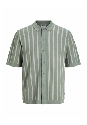 Short-sleeve button-up shirt in light green with white vertical stripes. Features a collar, textured fabric, and a straight hem.