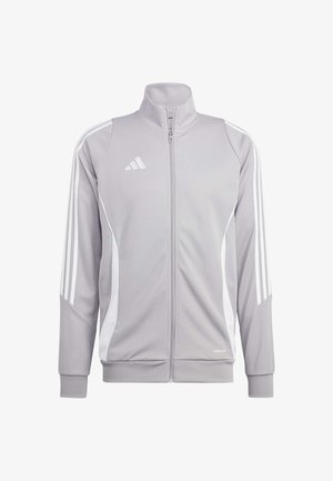 Veste de sport gris clair avec des accents blancs, fermeture à glissière sur le devant, col haut, et trois rayures blanches sur chaque manche. Fabriquée en tissu texturé et respirant.