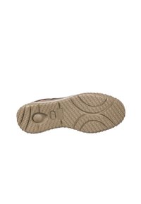 Suela de zapato con un patrón texturizado en panal en color beige. Presenta un relieve circular, detalles de crestas prominentes y un diseño de punta redondeada.