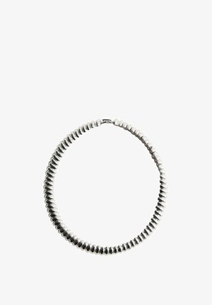 Flexible silver beaded necklace with rounded, closely linked segments forming a continuous loop and a small clasp on a white background.