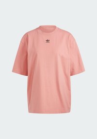 Pink cotton t-shirt with a round neck, short sleeves, and a small black logo on the chest. Casual, relaxed fit with a smooth texture.