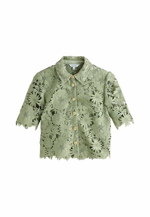 Světle zelená krajková krátká halenka s límečkem a zlatými knoflíky uprostřed vpředu.