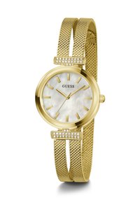 Montre avec bracelet en mailles dorées, dotée d'un cadran rond en nacre avec des index dorés, accentuée par une lunette ornée de cristaux.