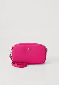 Pink rectangular crossbody bag made of textured material with a silver logo, featuring a zipper closure and an adjustable strap.