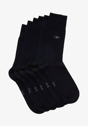 Donkerblauwe crew sokken, met een gladde textuur, ribbelband bovenaan en een klein logo-detail nabij de enkel; verkrijgbaar in een verpakking van zes.