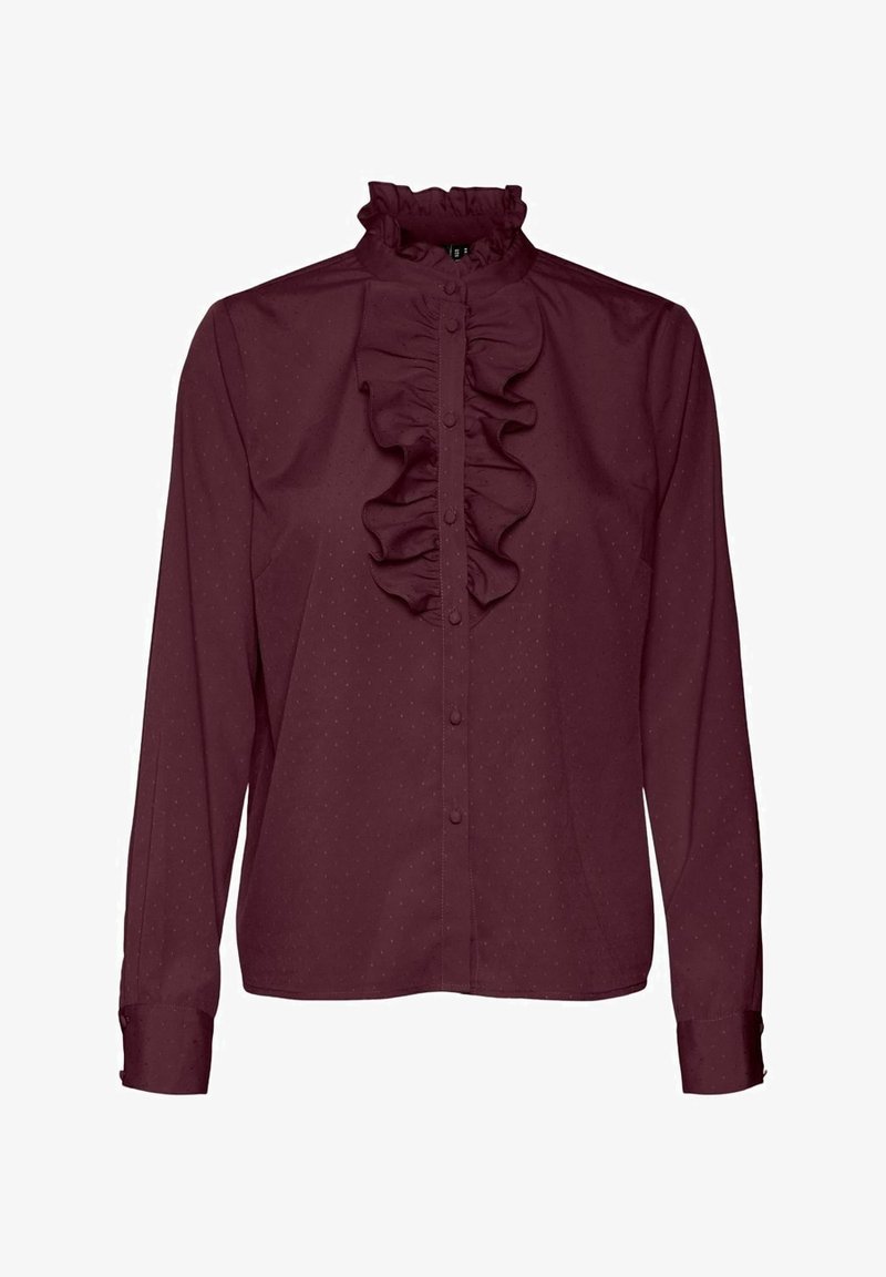 Blusa burdeos con un alto cuello con volantes, cierre frontal de botones, mangas largas y un pequeño patrón de puntos en toda la tela. Textura suave.
