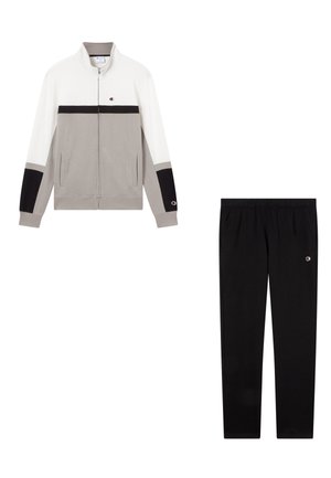 Completo sportivo composto da una giacca con zip grigia e bianca con dettagli neri e pantaloni neri abbinati. Tessuto in misto cotone.
