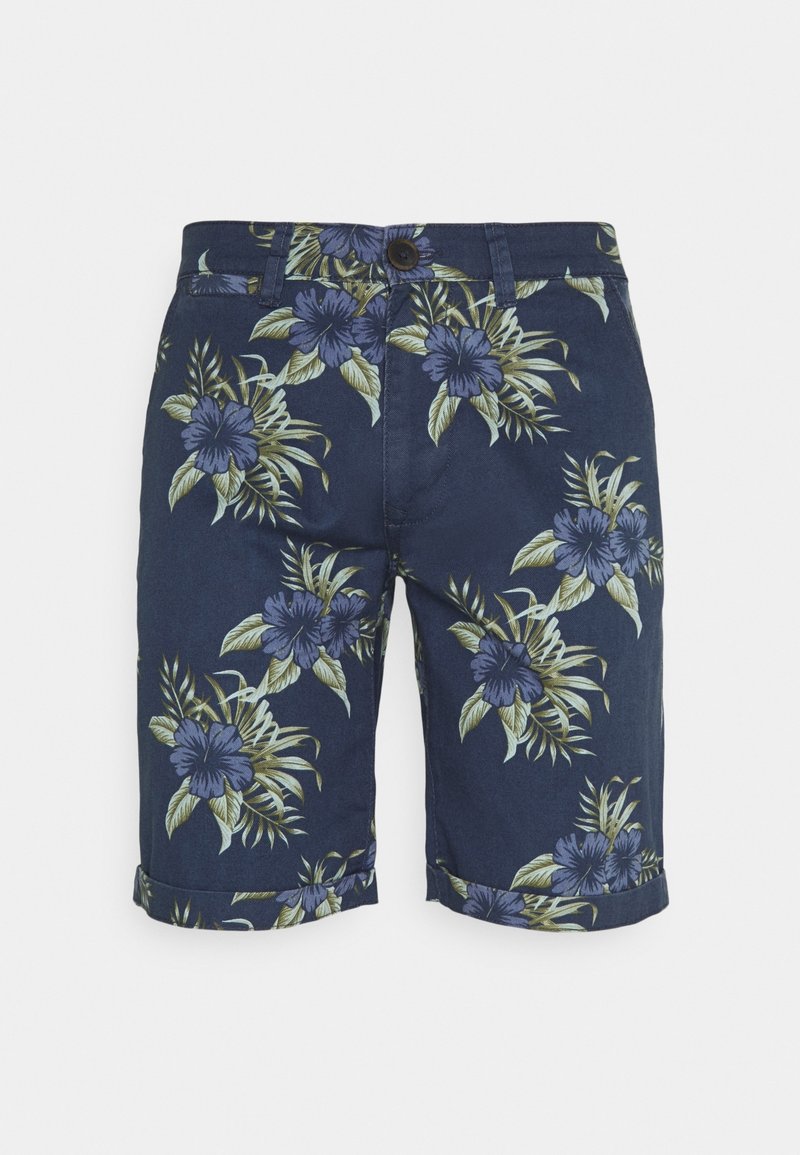 Tummansiniset shortsit, jotka on valmistettu kukkakuosisesta kankaasta purppuran ja vihreän sävyissä. Hameen reunoissa on käänteet.