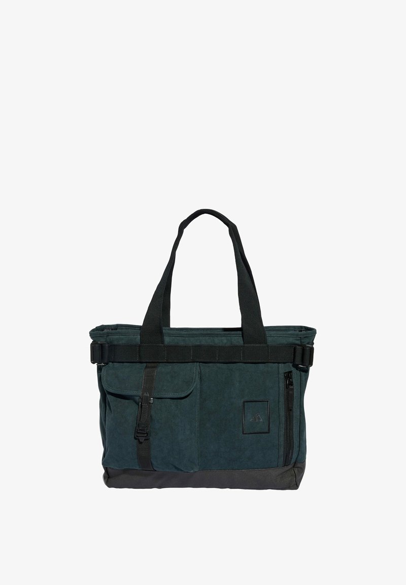 Dark green, canvas tote bag with dual handles, a black strap, front pockets, and a zipper closure; features a textured surface.
