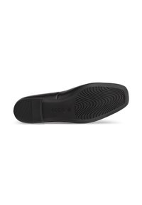 Chaussure en cuir noir avec une semelle en caoutchouc flexible, ornée d'un motif texturé pour l'adhérence et d'une marque discrète sur le côté.