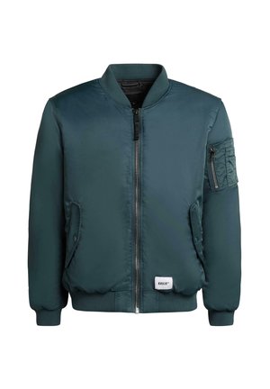 Giacca bomber di un verde scuro con zip frontale, polsini e orlo a costine, tasche laterali e una tasca con zip aggiuntiva sulla manica.