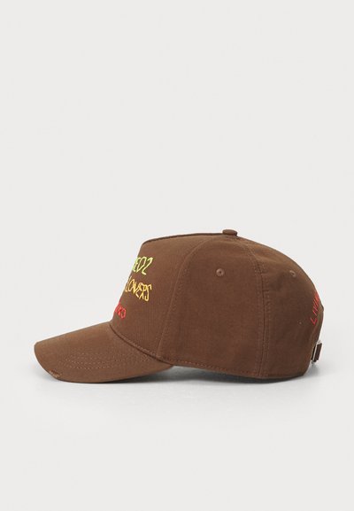 Brown cotton cap with a curved brim, featuring vibrant embroidered text in yellow and red. Adjustable strap at the back for fit.