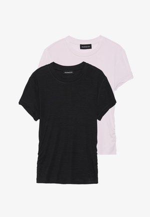 Two T-shirts: one black and one light pink. Both feature round necklines and short sleeves, made from a soft, lightweight fabric.