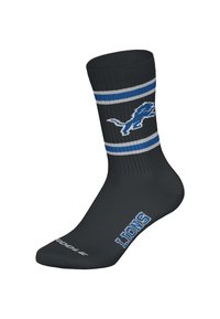 Czarna skarpeta za kostkę z niebiesko-szarymi paskami, z niebieskim logo lwa. Napis "LIONS" w kolorze niebieskim na części palcowej. Wykonana z elastycznego materiału.