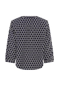 Navyblaue Bluse mit einem kreisförmigen Muster, langen Ärmeln, einem runden Ausschnitt und einem leicht geschwungenen Saum. Hergestellt aus einem leichten Stoff.