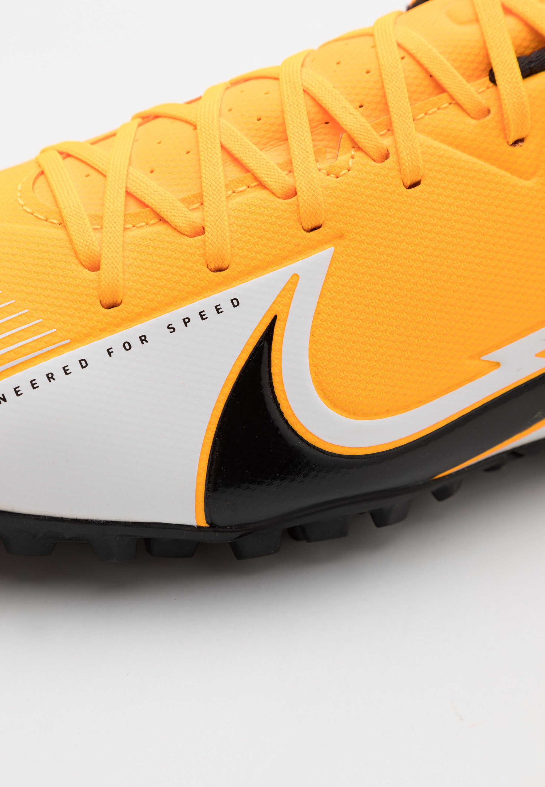 yellow nike astro turf