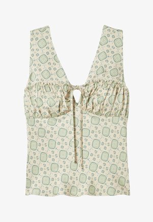 Top beige sin mangas con busto fruncido, cierre frontal con lazo y estampado floral y geométrico en verde.