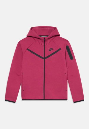 Felpa con zip Nike di un brillante colore rosa, con accenti neri e chiusura anteriore a zip. Presenta un cappuccio e una tasca laterale con zip sul braccio.