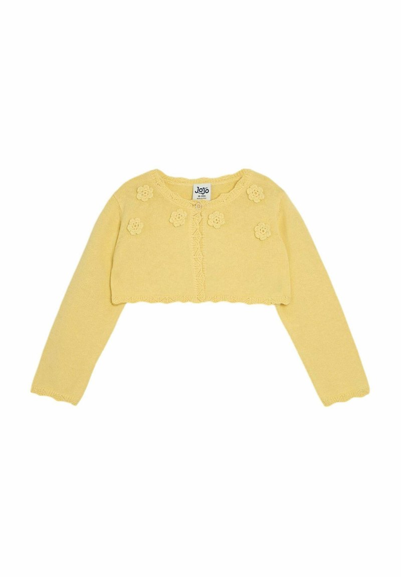 Žltý skrátený cardigan vyrobený z mäkkého pleteného materiálu, s kvetinovými aplikáciami vpredu, rebrovanými okrajmi a dlhými rukávmi.