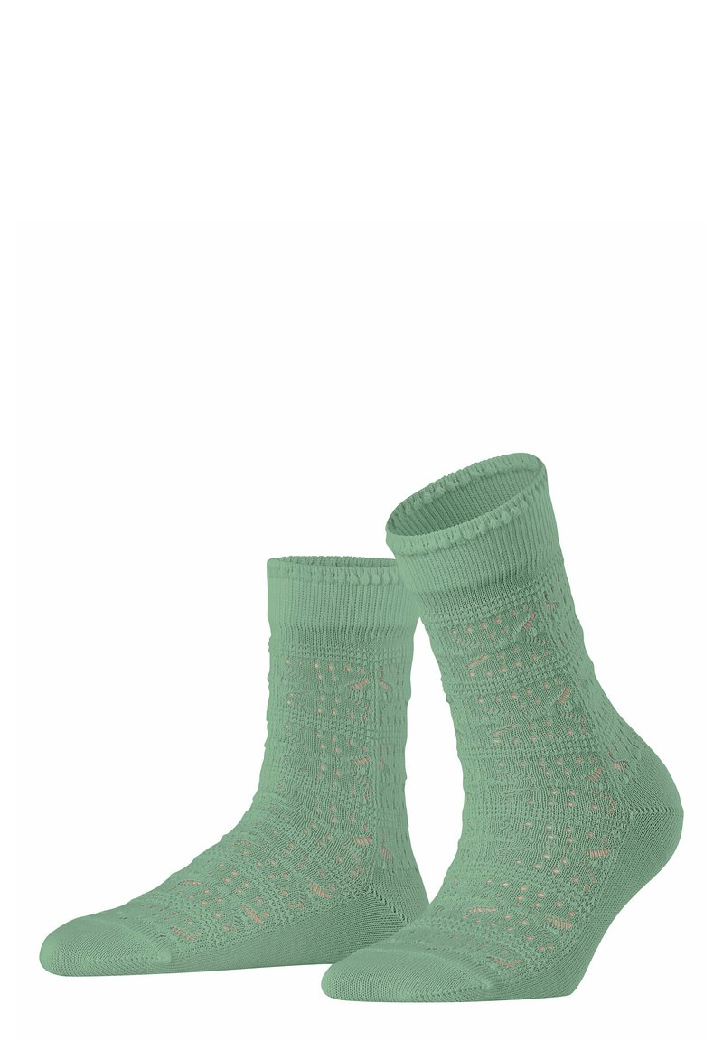 Mintgrüne Socken mit einem strukturierten, gemusterten Design. Gerippter Bund und verstärkte Zehen. Leichtes, weiches Material für hohen Tragekomfort.