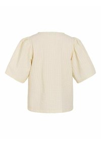 Krämfärgad kortärmad topp med en texturerad, quiltad design. Rutig form med rund halslinje och rynkade ärmar.