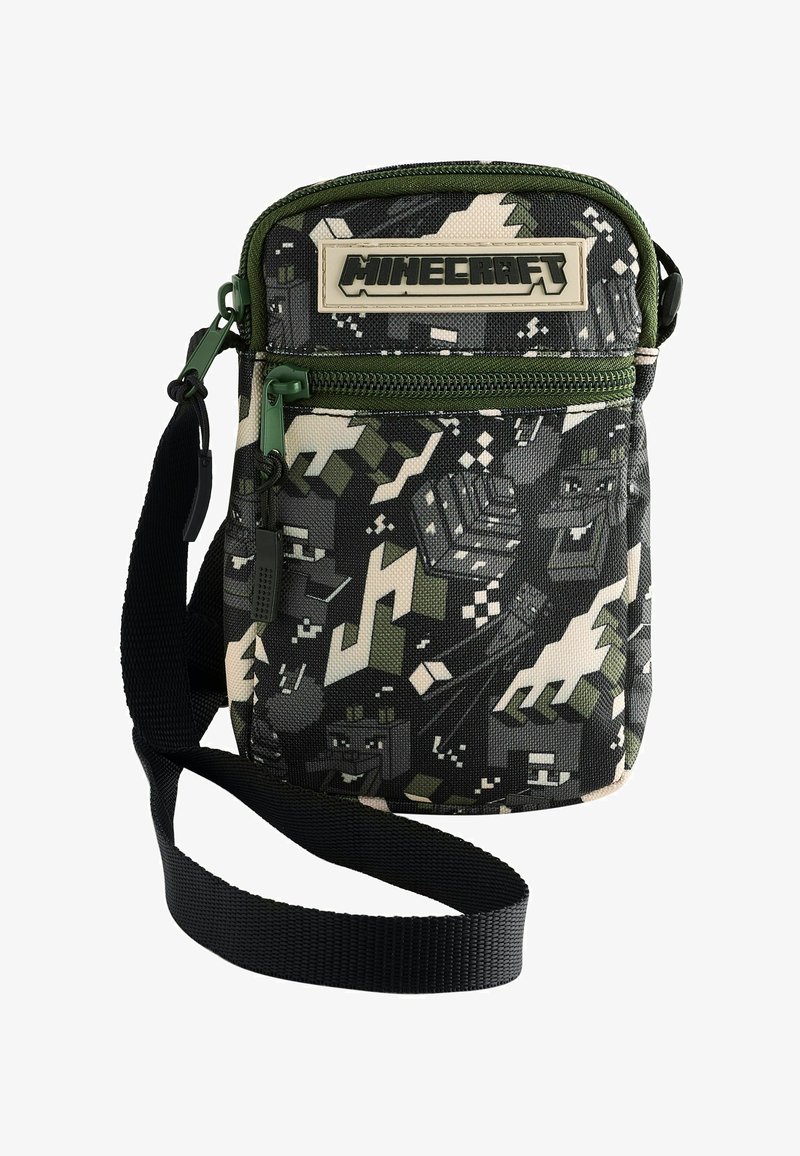 Petit sac à bandoulière sur le thème de Minecraft avec motif pixellisé noir, blanc et vert, fermeture éclair verte et sangle noire réglable.