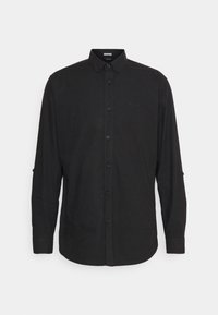 Maglietta nera a maniche lunghe con colletto a camicia, bottoni frontali e maniche arrotolabili con chiusura a bottone; realizzata in tessuto leggero.