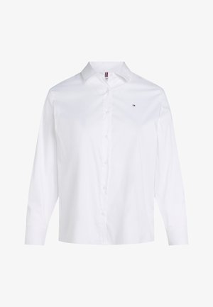 Camicia bianca a maniche lunghe con bottoni, realizzata in cotone, con colletto classico, patta frontale e un piccolo logo sul petto in alto a sinistra.