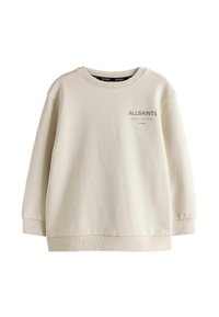 Sweat-shirt de couleur crème en tissu doux, avec un col rond, des manches longues et un logo imprimé sur le devant.