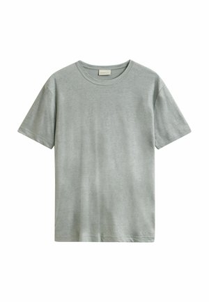 T-shirt en coton gris clair à manches courtes avec col rond, ourlet droit et étiquette de marque discrète à l'intérieur du col.