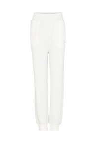 Witte sweatpants van zacht materiaal, met een brede elastische tailleband, twee zijzakken en taps toelopende boorden bij de enkels.