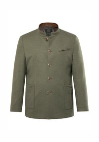 Chaqueta verde oliva con un cuello alto, cierres de botón, dos bolsillos delanteros y un bolsillo en el pecho, que cuenta con un forro interior de cuadros.