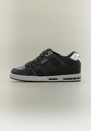 Black and gray low-top Globe sneaker with laces, padded collar, and visible air cushioning in the sole, shown in side profile on a neutral background.