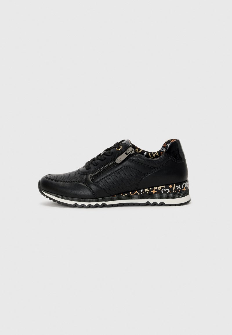 Black leather sneaker with textured accents, zip closure, and patterned interior. Features a contrasting patterned sole and zigzag tread.