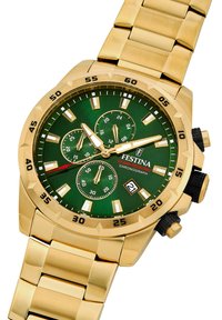 Zelta hronogrāfa pulkstenis ar zaļu ciparnīcu, baltām stundu apzīmējumu zīmēm, trim apakšciparnīcām un datuma rādītāju. Metāla saišu aproce ar melniem akcentiem.